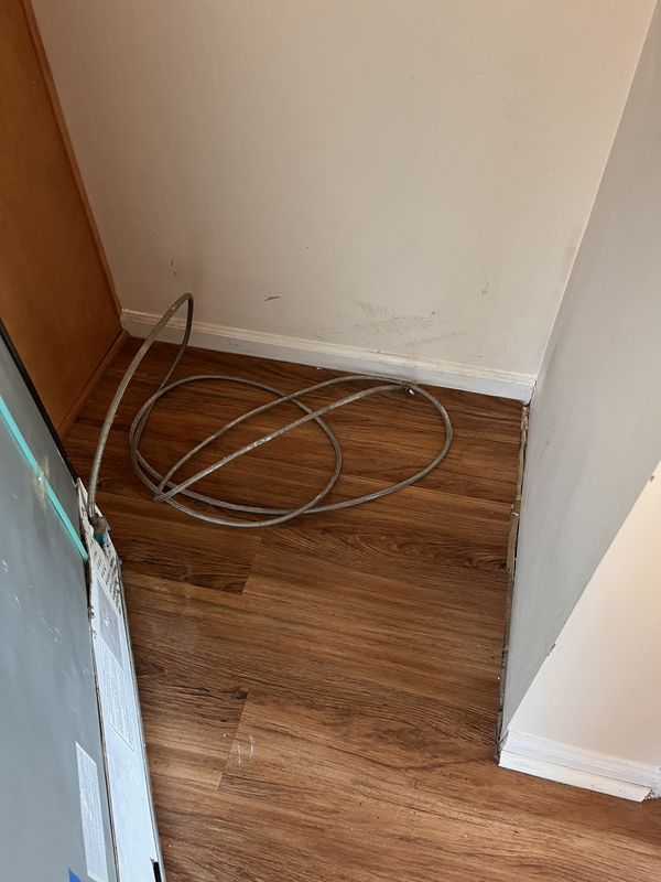 After: the floor behind a fridge after cleaning