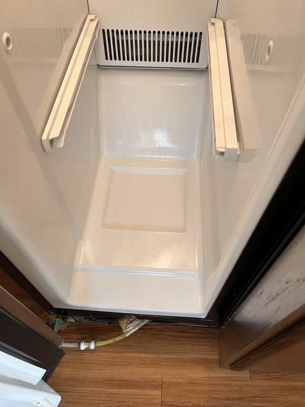 After: the inside of a fridge after cleaning