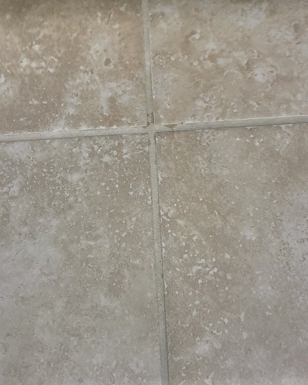 After: tile floor with clean, light grout lines
