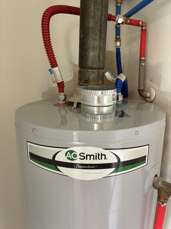 After: the top of a water heater after cleaning