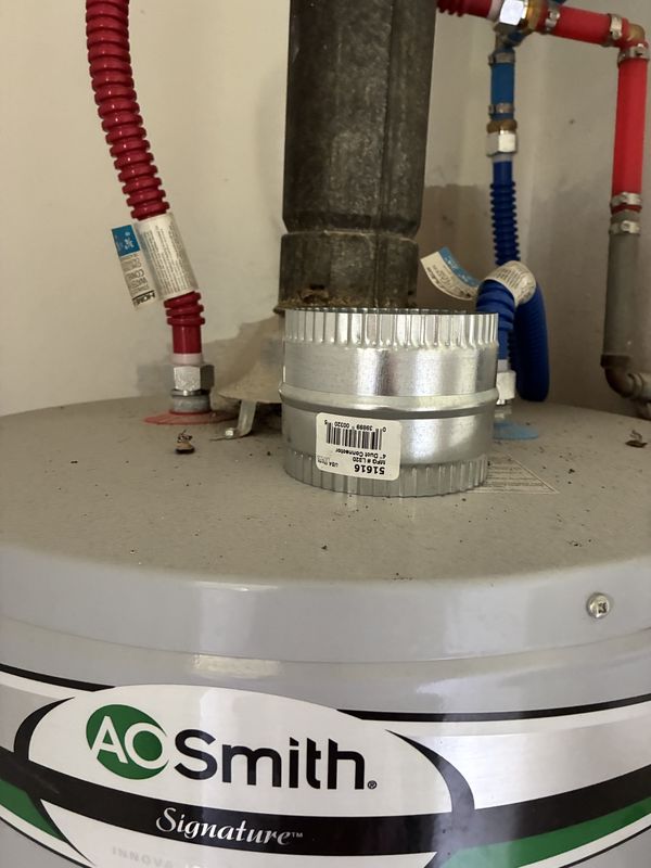Before: the top of a water heater before cleaning